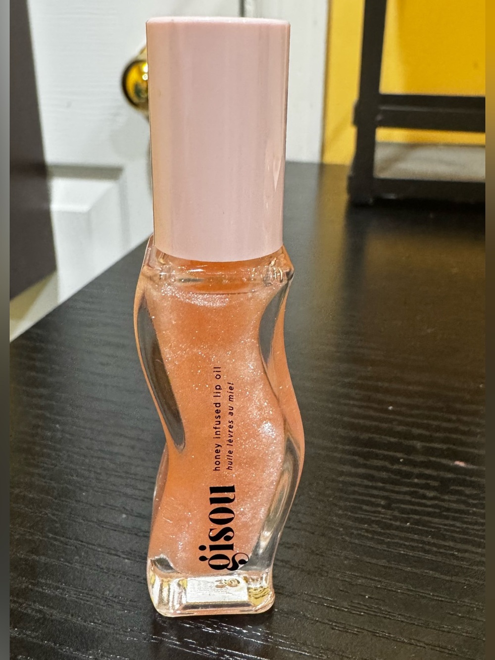 Gisou Honey Infused Lip Oil in the shade Watermelon Sugar.